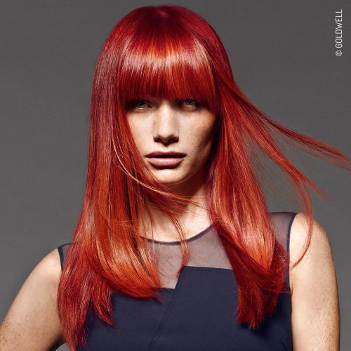 model with vibrant red hair from Goldwell