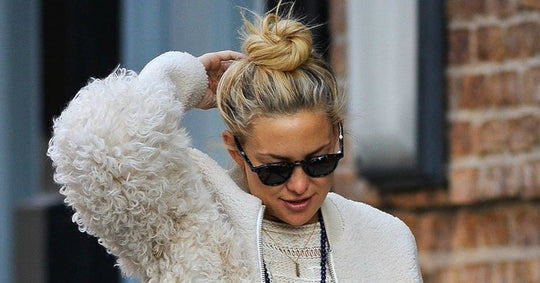 Photo of Kate Hudson with a messy hair bun